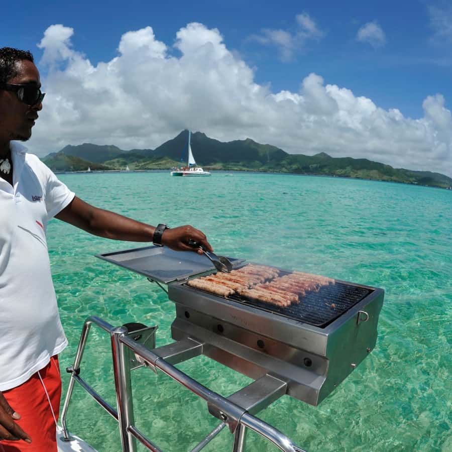 Catamaran trip to Ile Aux Cerfs With Two Way Transportation - Boarding a catamaran for a shared day at sea