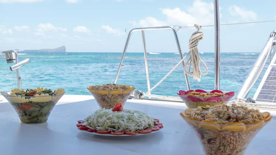 Full Day Catamaran Luxury Cruise to Northern Islands w Lunch - Gunners Coin, the dramatic rock on the way north