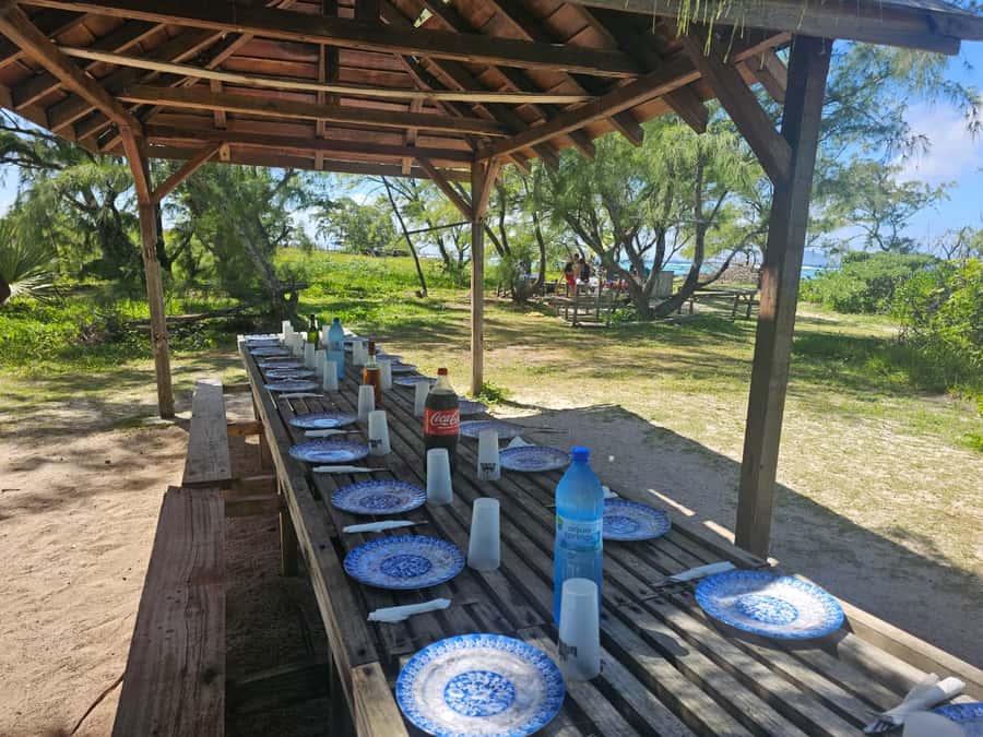 Grand Bay: Catamaran Cruise to Flat Island with BBQ Lunch - A peaceful island stop, with a party-boat soundtrack