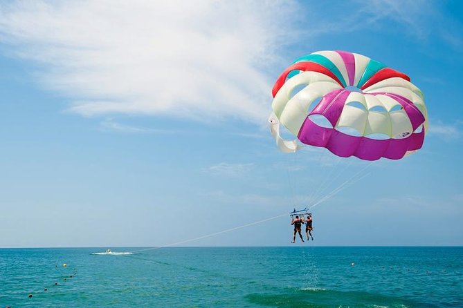 Ile aux Cerf: Speed boat with Parasailing & Tube Riding and Lunch - Parasailing above the Mauritian lagoon